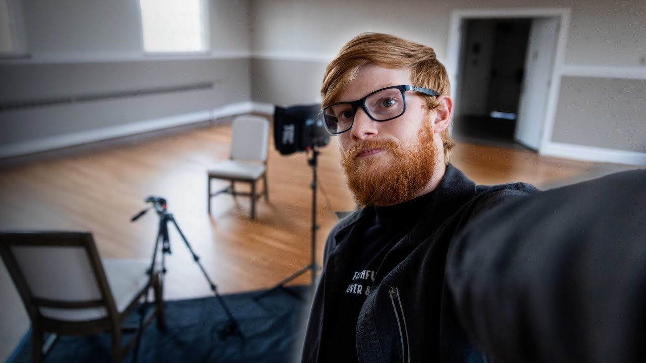 Hunter Bolton in a studio, with lights and a camera set up for an interview